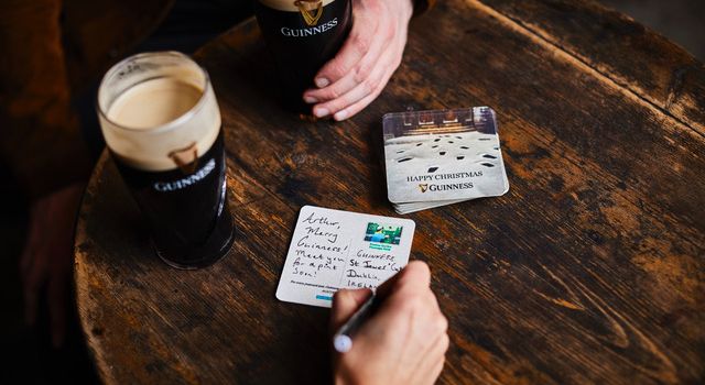 Pints of Guinness with postcards