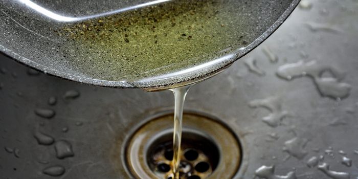 Oil being poured down the sink