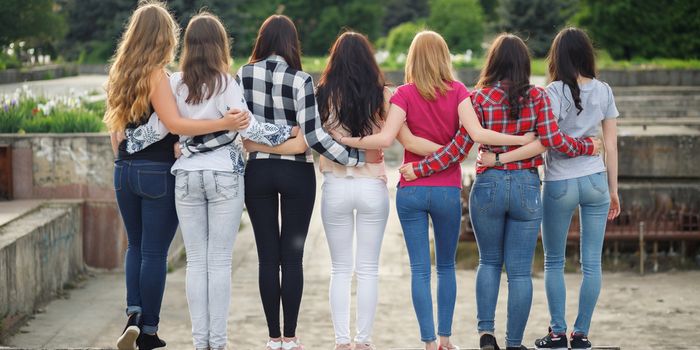 girls wearing skinny jeans in park