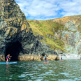 Explore the Copper Coast with this stand-up paddleboarding tour in Waterford