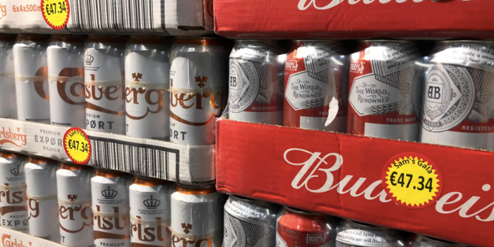 slabs of carlsberg and budweiser cans stacked on top of one another, with €47.34 price tags