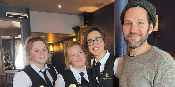Paul Rudd smiling for a picture with three members of staff at the Commodore Hotel in Cobh