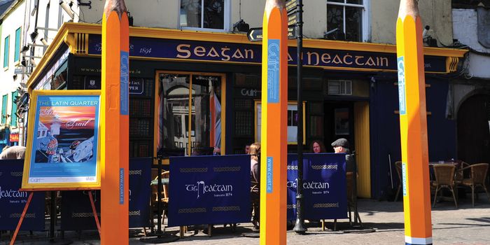 eight foot tall pencils outside Carroll's pub in Galway
