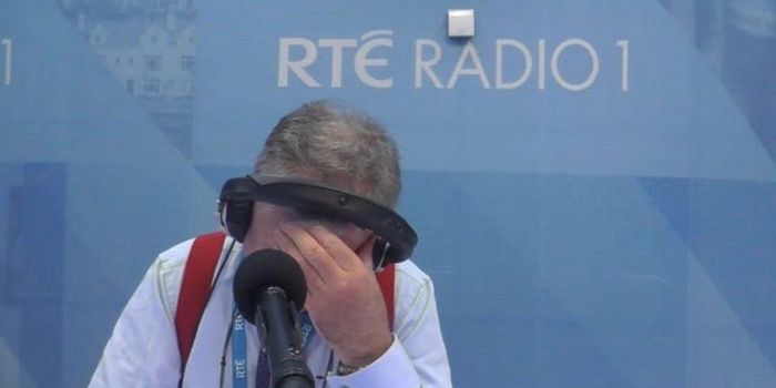 Joe Duffy on Liveline with his head in his hand, "RTE Radio 1" signage on the wall behind him