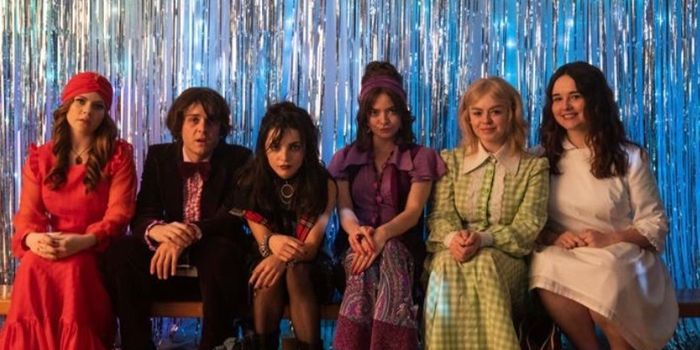 wee mammies from last nights derry girls, sitting on a bench wearing 70s clothing