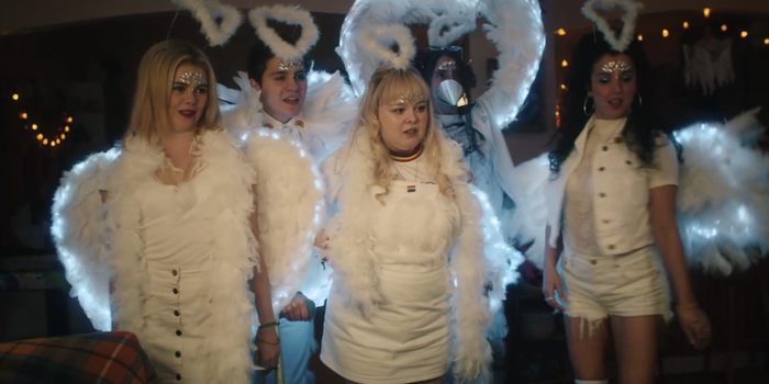 Derry Girls cast dressed in white with feathery wings and halos.