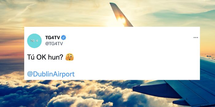 screenshot of tweet from TG4 which reads "Tú ok hun?" with Dublin Airport tagged below. Stock image of a plane in the sky in the background