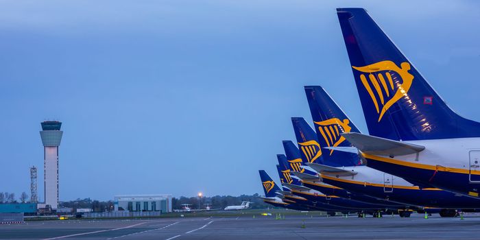 several ryanair planes parked beside each other in airport