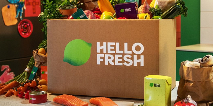 cardboard hellofresh box filled with fruit, veg and other ingredients
