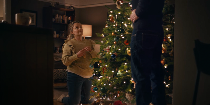still from the John Lewis Christmas ad, woman decorating a christmas tree