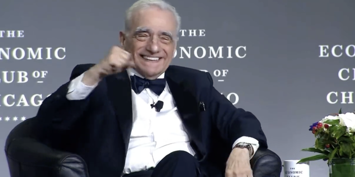 martin scorsese smiling and punching the air during an interview