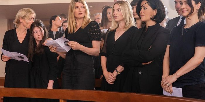 bad sisters cast dressed in black standing in line at a church pew