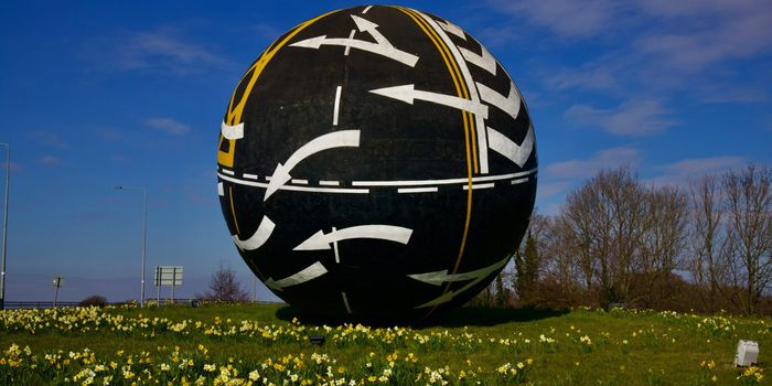 The Naas Ball - a large round statue covered in traffic markings