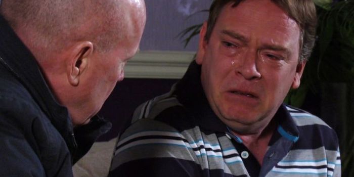 still from eastenders, which shows ian beale crying to phil mitchell
