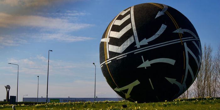 the naas ball, a large spherical sculpture on a roundabout decorated with road markings